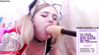 Ponytailed platinum-blonde lady is inhaling a giant fuck stick in front of the web camera, just for joy