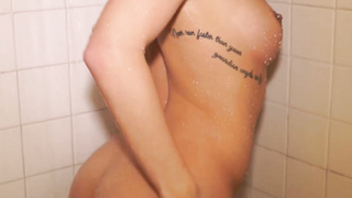 Petite breasted towheaded with pierced puffies is banging her hairless cunt with a faux-cock, in the douche