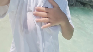 Bitchy lady is softly jacking while on the beach, in the middle of a gorgeous day