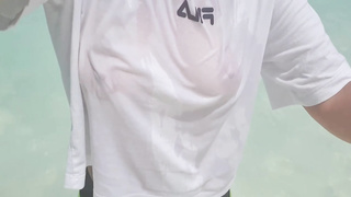 Bitchy lady is softly jacking while on the beach, in the middle of a gorgeous day