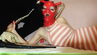 Wild blond honey is dressed in a crimson, spandex mask while her paramour is toying with her