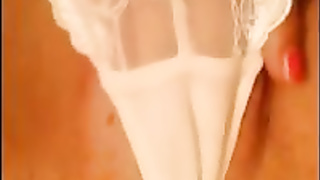 Super-Hot doll in white underpants is mildly rubbin' her vag, in front of the web camera
