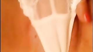 Super-Hot doll in white underpants is mildly rubbin' her vag, in front of the web camera