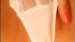 Super-Hot doll in white underpants is mildly rubbin' her vag, in front of the web camera