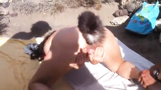 Eva Sumisa is tugging on the beach in the middle of the day, in front of homies