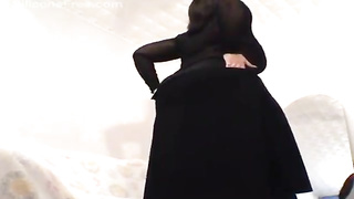 Round brown-haired with enormous bra-stuffers, Galina is switching clothes in front of the camera, just for joy