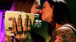 Tatted lesbos are gobbling each other up in front of the camera and groaning while jizzing