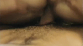 Chinese dark haired, Mia Li is gargling a large, black spunk-pump and getting boned on her sofa