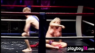 Bulky buxom blond mature hitting a fellow in the boxing ring