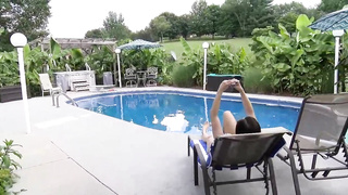 Excellent looking dark-haired with massive, rock-hard jugs is milking on the sunbed, during the day