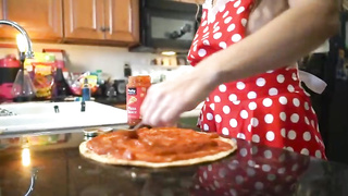 Sex-Positive light-haired doll with good-sized knockers is making pizza while dressed in nothing but the apron