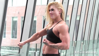 Bulky towheaded, Angel Face is posing in front of the camera and luving it a pile