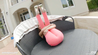 Infatuating teenie dark haired is posing and taunting in front of the camera, just for joy