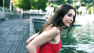 Enticing dark haired teenie is lovin’ opening up her gams and displaying puss on the sofa for the camera