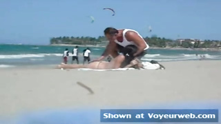 Fledgling honey in sans bra is praying strangers on the beach to grope her cute pointy bumpers