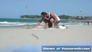 Fledgling honey in sans bra is praying strangers on the beach to grope her cute pointy bumpers