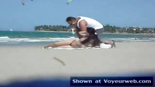 Fledgling honey in sans bra is praying strangers on the beach to grope her cute pointy bumpers