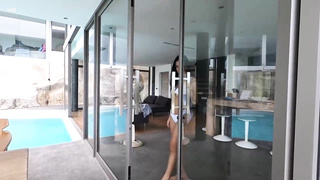 Thai dark haired with huge, hard mounds is stroking next to the swimming pool, during the day