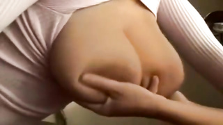 Hefty boobed female is posing without bra in front of the camera, while her counterpart is massaging her
