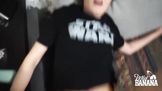 Nerdy woman with glasses is gargling her roomy's pipe while getting down on all fours in front of him