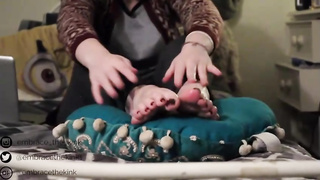 Ultra-Kinky teenager black-haired is showing her feet in front of the web camera, once in a while