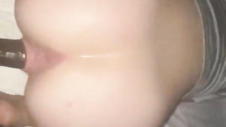 Her face is in the cushion with her backside up