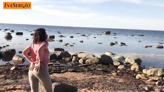 Brown-Haired in yoga trousers is deep-throating a random stranger's trouser snake on the beach, during the day