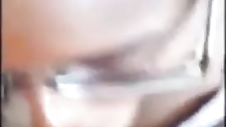 Stunner with glasses is gargling a thick, black knob as deep as she can, just for joy