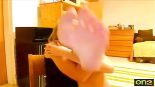 Super-Cute lady is displaying her soles on live web cam every once in a while, just for joy