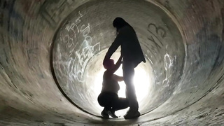 Inexperienced doll is getting on all fours on the ground and deep throating a rock rigid boner in a public place