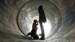 Inexperienced doll is getting on all fours on the ground and deep throating a rock rigid boner in a public place