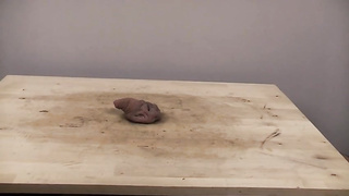 Accomplished nymph is dressed in sports boots while providing a feetjob to a boy from the surroundings