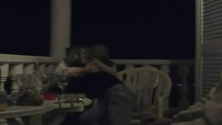 Excited lesbos began making out on the balcony and shortly they were tonguing each other up