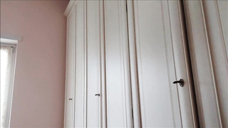 Wild brown-haired with huge glasses is showcasing her boobies and pointy nips in front of the camera