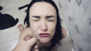 Spunky black-haired with diminutive melons is providing a blow-job to her paramour and hoping a facial cumshot popshot