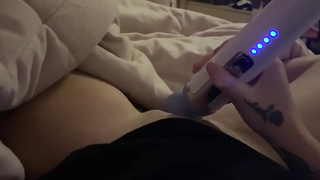Inked gal is wailing while playing her twat with a magic wand, because it perceives so drilling fine