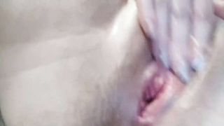 Kinky, inexperienced honey is intensively fingerblasting her dribbling humid cootchie in front of the camera