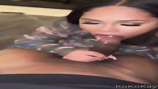 Koko Kay is impatiently deep throating a hefty, black stiffy before getting it from the back