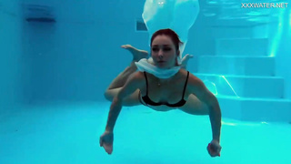Uber-Cute nymph is permanently dressed in little swimsuits and highly leisurely getting bare while swimming alone
