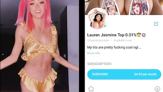 Rosy haired honey is posing and taunting in front of the web camera and liking it