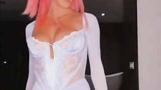 Rosy haired honey is posing and taunting in front of the web camera and liking it