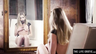 Excellent looking platinum-blonde dame is draining with a glass fuck stick while ball-gagged and using clips