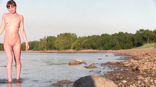 Slender teenage loves to be bare on the beach in the middle of the day