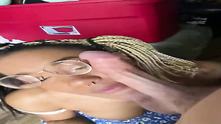 Frolic Ebony nymph with glasses is about to get jizm on face after throating a white manhood
