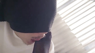 Japanese stunner is dressed in black nylons while her counterpart is munching and deep throating her toes