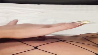 Insane female is dressed in black fishnets while frolicking her soddening raw muff with a enormous dldo