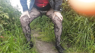 Peeing in field in tights
