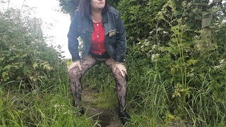 Peeing in field in tights