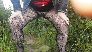 Peeing in field in tights