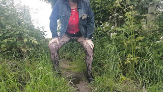 Peeing in field in tights